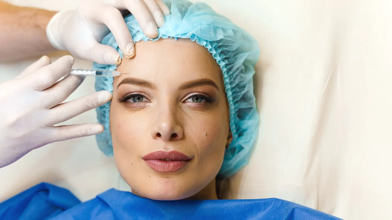 Woman receiving cosmetic facial injection